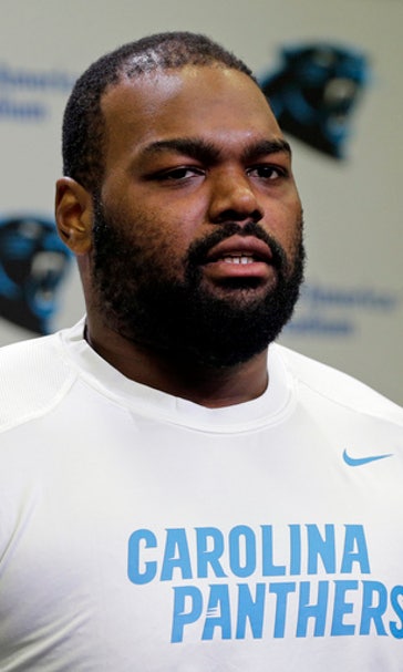 Newton doesn't throw at Panthers camp; Oher doesn't practice